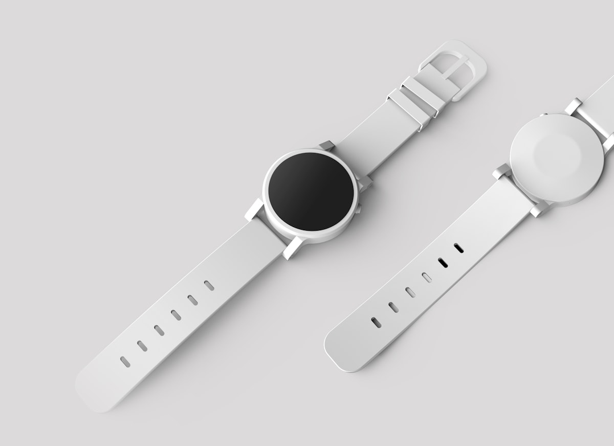 Input product photo: minimalist white smartwatch with a blank black dial